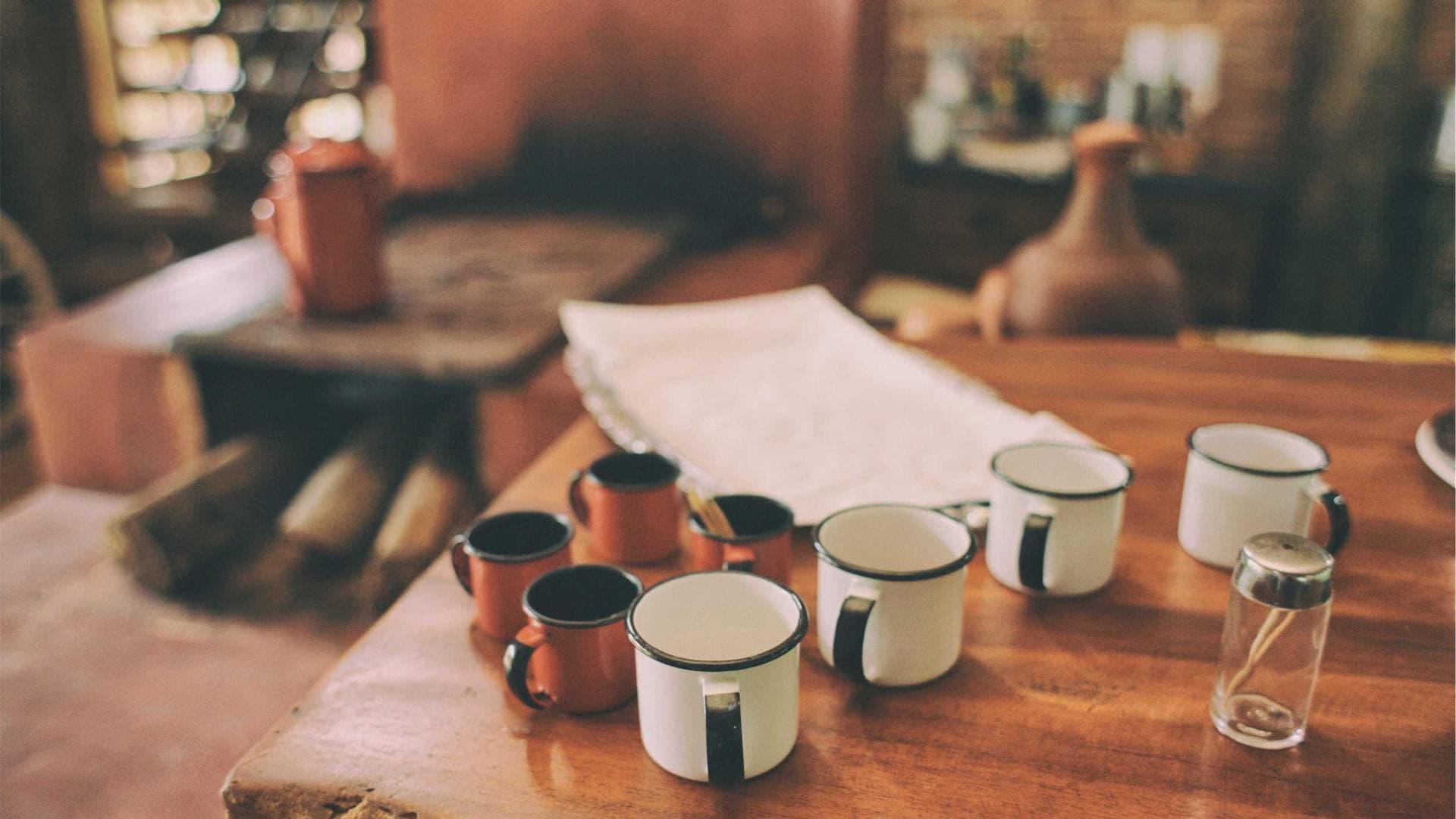 Close-up of a person typing on a laptop with code on screen